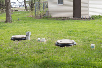 Septic system installed in the backyard. Two chamber septic tank installed in a rural house