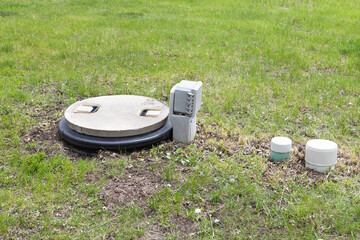 Septic tank alarm system. Concrete septic tank with alarm system and inspection port