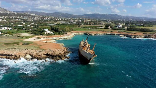 Abandoned Edro III Shipwreck at seashore of Peyia, near Paphos, Cyprus. Historic Edro III Shipwreck site on the shore of the water in Cyprus. Aerial view of Shipwreck EDRO III, Pegeia, Paphos.