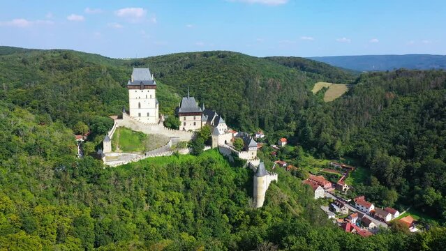 Royal Castle Karlstejn. Central Bohemia, Karlstejn village, Czechia. Aerial view to The Karlstejn castle. Royal palace founded King Charles IV. Amazing gothic monument in Czech Republic, Europe.
