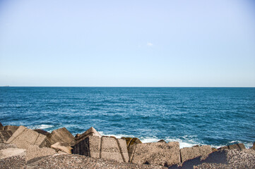 Sea view from a pier. blue sky without clouds. Horizon. Calm concept.