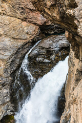 Waterfall near Lake Iskanderkul in early spring in the Fan Mountains in Tajikistan