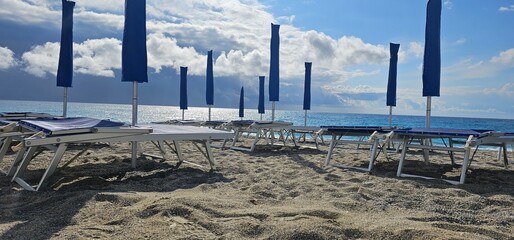 Spotorno, Ligurian Riviera in summer. A bathing establishment is a tourist facility located near a...