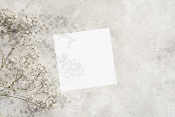 Square paper card mockup with copy space for invitation or flyer design, blank wedding card mock up with copy space © nikavera
