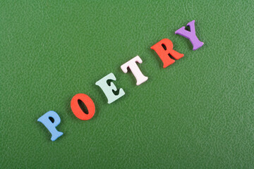 POETRY word on green background composed from colorful abc alphabet block wooden letters, copy...