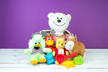 Collection of colorful toys on a purple background. Kids toys.