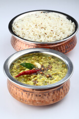 Mung Dhal or lentil curry. Moong Dal - Indian Cuisine curry. Mung bean Tadka ,Vegetarian dish with mung beans, zira cumin, coriander and chili tadka