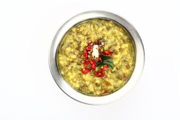 Mung Dhal or lentil curry. Moong Dal - Indian Cuisine curry. Mung bean Tadka ,Vegetarian dish with mung beans, zira cumin, coriander and chili tadka