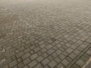 Cobblestone texture. Gray paving stones outside close-up. Design blank