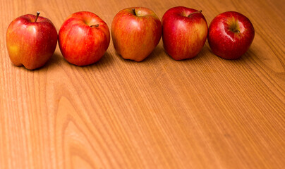 photography of red apples on wooden background