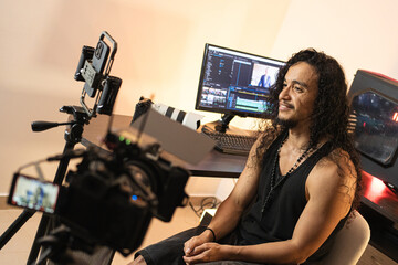 Creative Workflow with Technology. A long-haired content creator immersed in his studio, recording...
