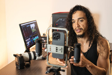 Studio Rig for Video Creation. A long-haired content creator immersed in his studio, recording...