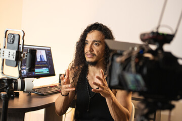 Visual Media Creation Space. A long-haired content creator immersed in his studio, recording videos...