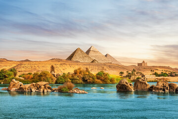 The Nile river and ancient rocks in the Aswan desert by the pyramids, Egypt