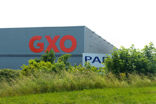 GXO Logistics Warehouse Exterior View On A Sunny Day With Clear Skies