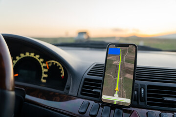 Phone navigator in car, travel concept