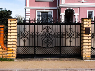 black metal fence with gate