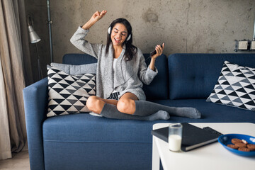 young attractive woman in casual outfit relaxing at home