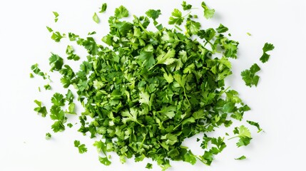 Obraz premium A top view of chopped coriander sprinkled artistically, showcasing the herb's vibrant color and fresh appeal on a white background