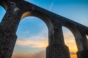 Sunrise with colored sky in aqueduct of the site arches in tepotzotlan state of Mexico
