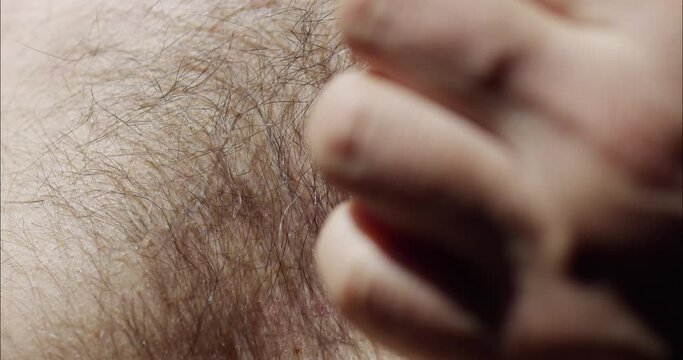 Scratch hairy male chest. Stroking a part of the body with the hand.
