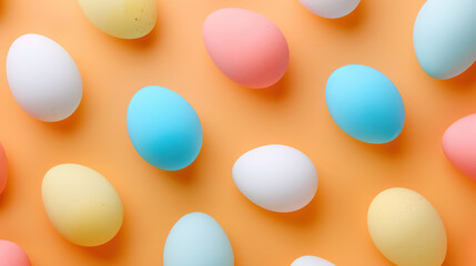 Colorful pastel eggs on a vibrant orange background