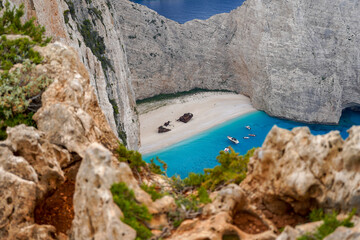 famous upper viewpoint of the Navagio Beach shipwreck surroundedby limestone cliffs