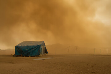 A lone tent stands against a foreboding orange sky in an empty, eerie terrain