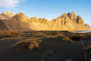 Northern grace along coastline and glorious Vestrahorn mountains in Iceland. Famous Stokksnes...