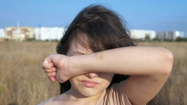 Child after bulling. A view of little girl hand with bruise after school violence during childhood.