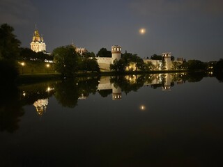 reflection of the monastery in the pond