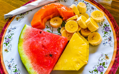 Plate with selected fruits papaya banana watermelon pineapple Costa Rica.