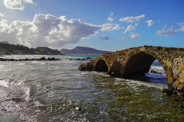 ancient stone bridge in Argassi beach in Zakinthos , Greece