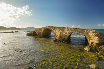 ancient stone bridge in Argassi beach in Zakinthos , Greece