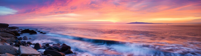 Obraz premium Vibrant sunset over serene ocean landscape