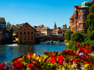 Peaceful cityscape of Strasbourg during summertime. Streets and canals of French city decorated...