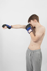 A Shirtless Teenage Boxer Boy