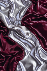 An elegant scene of shimmering silver and rich burgundy waves swirling together, mimicking the luxurious drape of silk velvet.