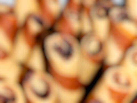 An abstract, out-of-focus background of a close-up of an Astor cake.