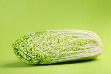 Half of fresh Chinese cabbage on light green background
