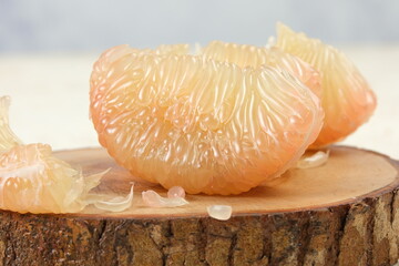 Fresh Peeled Pomelo (Jeruk Bali), Grapefruit or Shaddock on a Plate,White Background