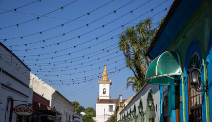 Lamped historic houses and church in the background in the city of Morretes Parana Brazil