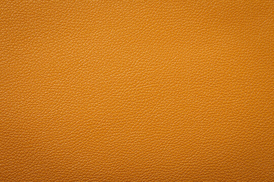 Synthetic leather brown background texture. Brown leather textured background.