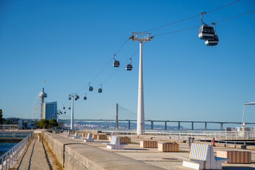 Telecabine Cable car in Lisbon in Parque des Nacoes Nations Park with Vasco da Gama bridge. Lisbon,...