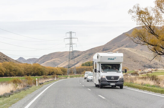 Vehicles travelling through the Lindis Pass Alpine Highway, New Zealand.