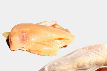 Uncooked raw chicken  breast fillets on white background.