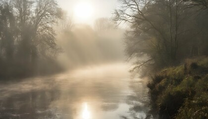 Obraz na płótnie Canvas A misty morning on the river with the sun breakin