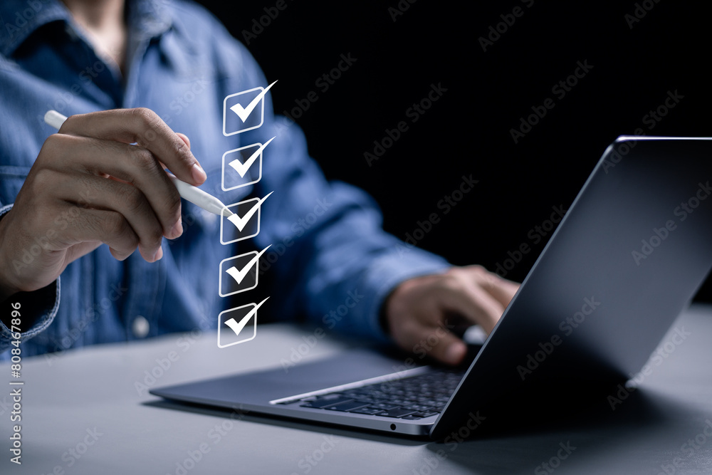 Poster checklist concept, businessman use laptop to taking online checklist survey on virtual screen, filli