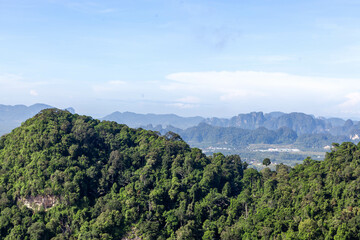 Thailand, Krabi province landscape. View from Tiger Cave Temple (Wat Tham Suea). Green jungles and limestone mountains.