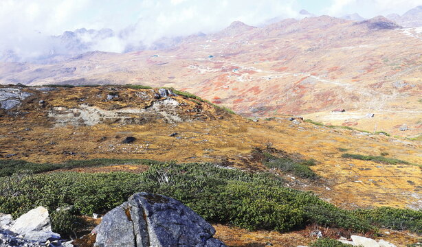 cloudy alpine landscape of nathang valley, high himalaya region of east sikkim near controversial doklam plateau (india china bhutan tri junction)